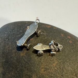 Vintage silver roller skate charms. One small, one slightly larger. Wheels move!